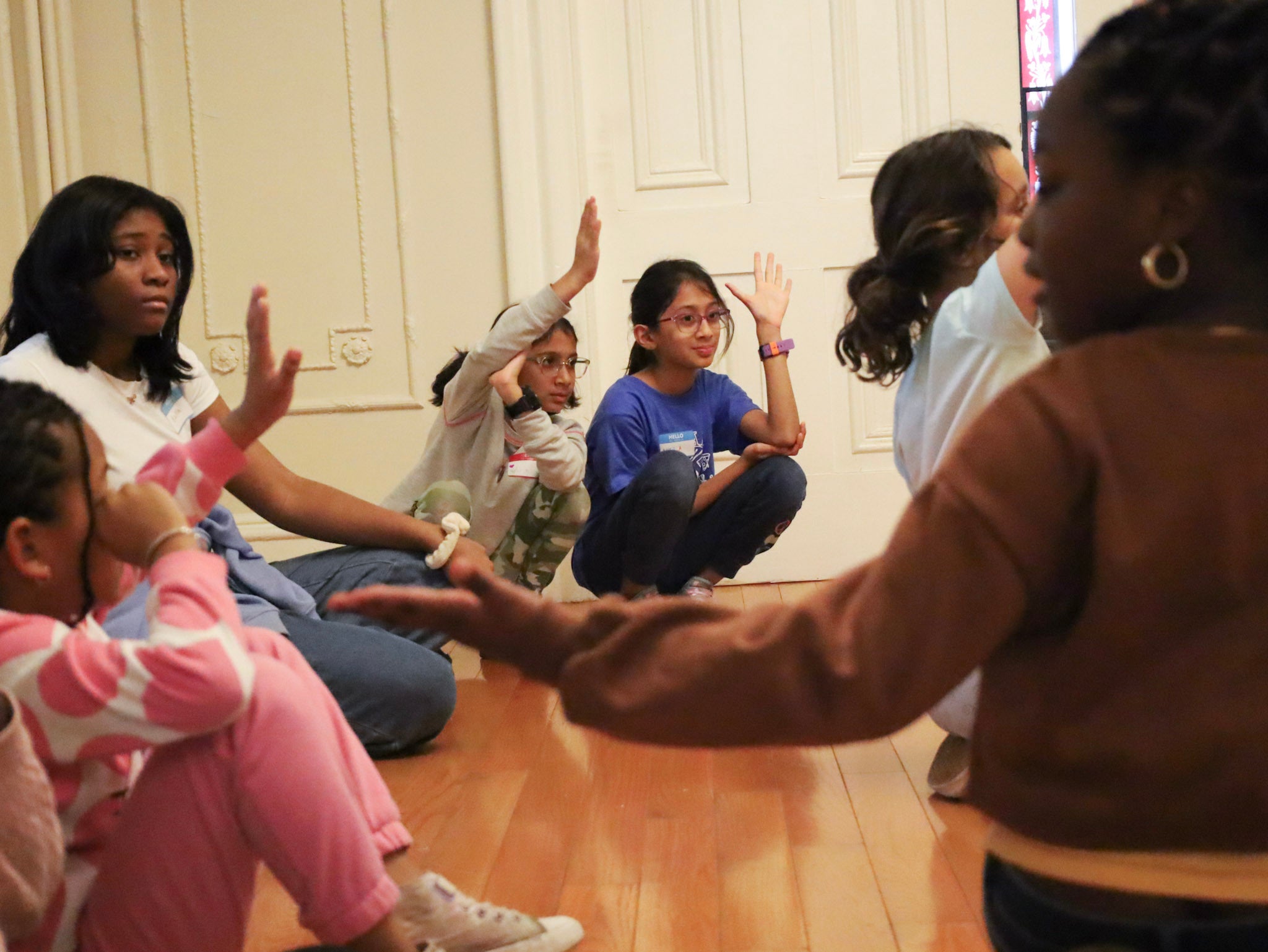 Kids in a group participating in the workshop