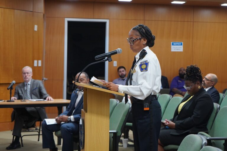 Katrina Blackwell speaking at a podium