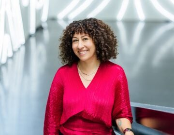 Christina Vassallo looks on