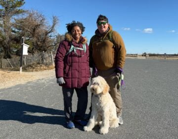 Taylor Lutz, her husband and their dog pose for photo at Cape Henlopen State Park in Delaware on Jan. 1, 2026
