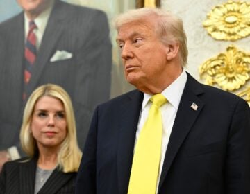 President Donald Trump and Attorney General Pam Bondi listen as FBI Director Kash Patel speaks during an event in the Oval Office at the White House, Oct. 15, 2025, in Washington.