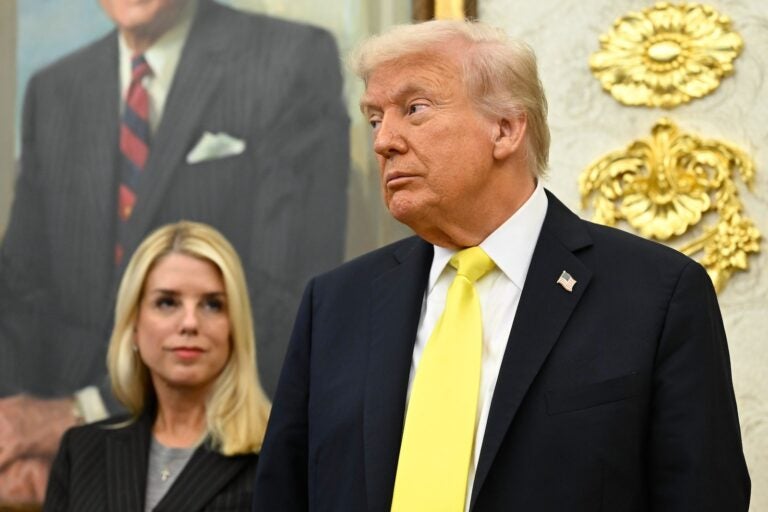 President Donald Trump and Attorney General Pam Bondi listen as FBI Director Kash Patel speaks during an event in the Oval Office at the White House, Oct. 15, 2025, in Washington.