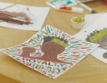 Kwanzaa related cards on table at Delaware Kwanza event