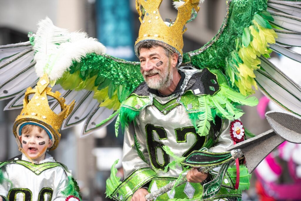 Two marchers for the Golden Sunrise Fancy Division in “King Kelce” costumes