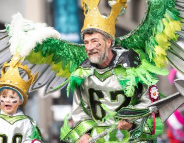 Two marchers for the Golden Sunrise Fancy Division in “King Kelce” costumes