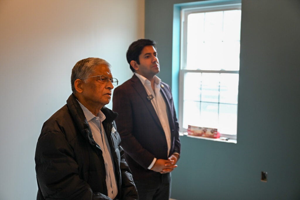 Nand Todi (left) receives a tour of the Lansdale shelter