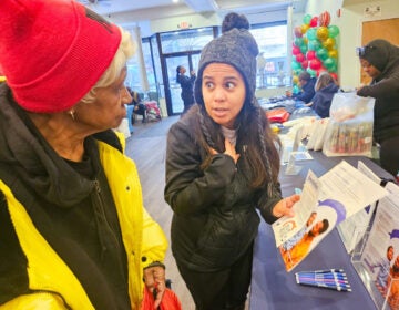 pennie-fair-pennsylvania-NL-122225-01 Laura Polo talking with fair attendee about health insurance