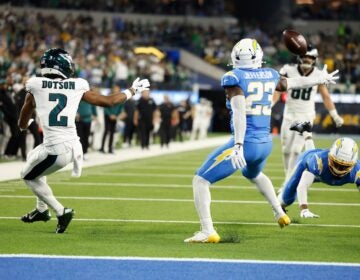 Los Angeles Chargers safety Tony Jefferson (23) intercepts a pass intended for Philadelphia Eagles wide receiver Jahan Dotson (2) during overtime of an NFL football game Monday, Dec. 8, 2025, in Inglewood, Calif