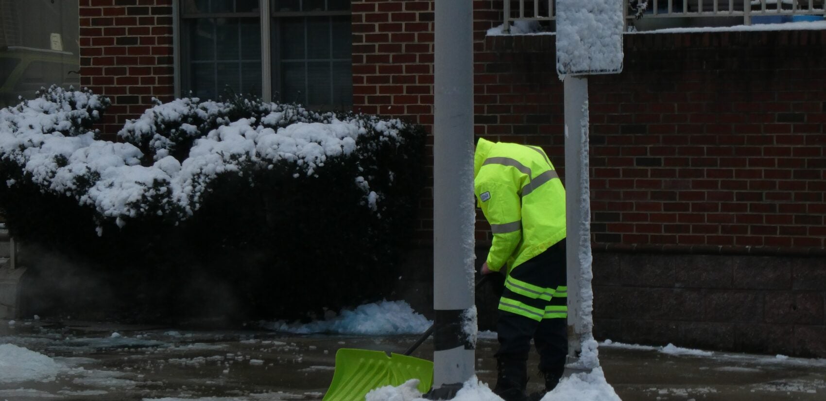 a person shovels snow