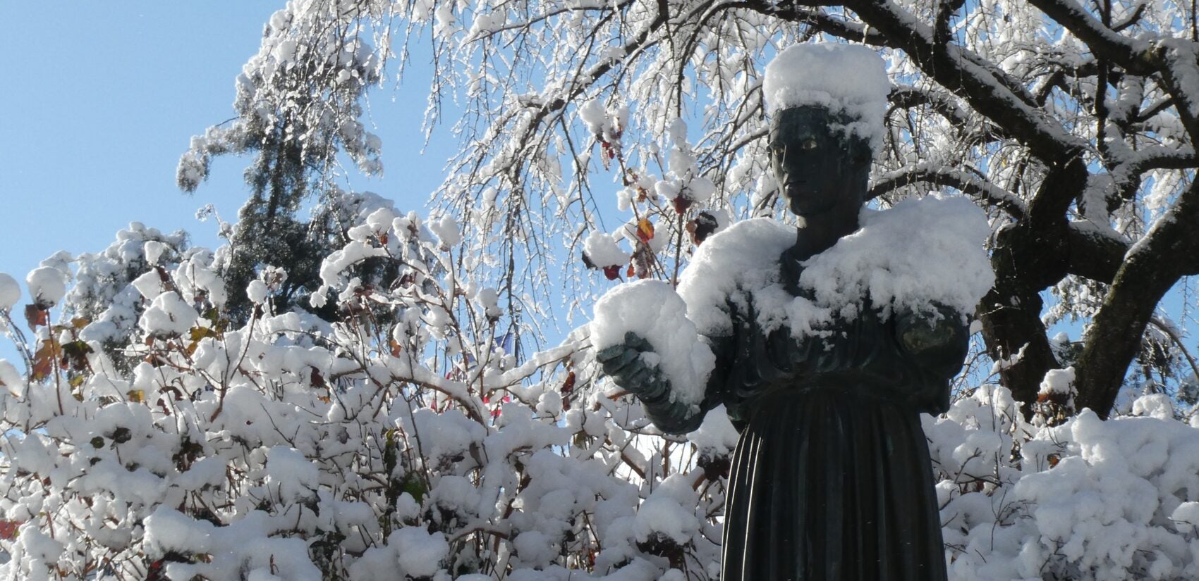 a statue covered in snow
