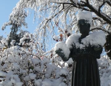 a statue covered in snow