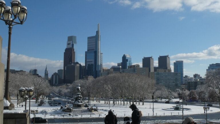 a skyline view of Philly with snow