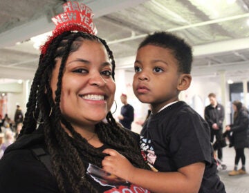 Cherelle Moore (left) holds her 2-year-old son Qadir at the Please Touch Museum in Philadelphia