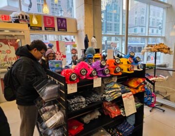 Customers look at items inside the SEPTA store in Philadelphia