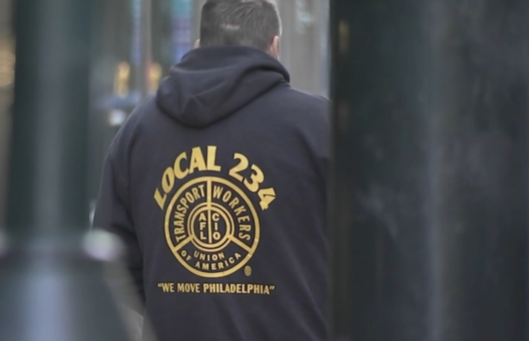 A man wearing a sweatshirt with the Local 234 logo on it