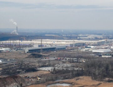 An aerial view of smoke rising from an industrial factory site in a rural area of Falls Township, Pa.