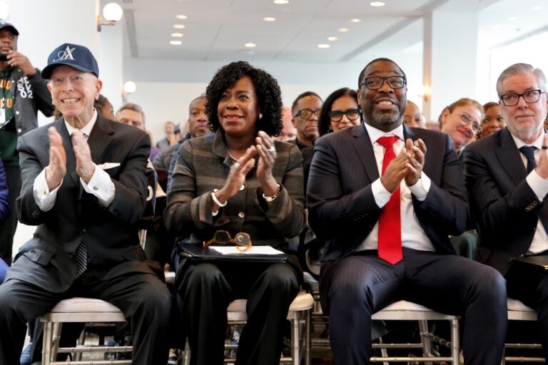 Carl Dranoff, Cherelle Parker, Kenyatta Johnson and John Fry sitting in the front row of the press conference and applauding.