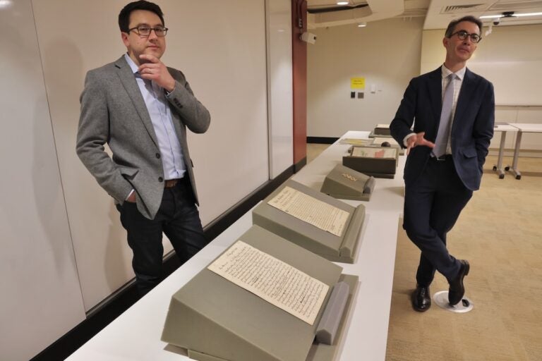 Curators Michael Blaakman (left) and Gabriel Swift (right) posing for photos