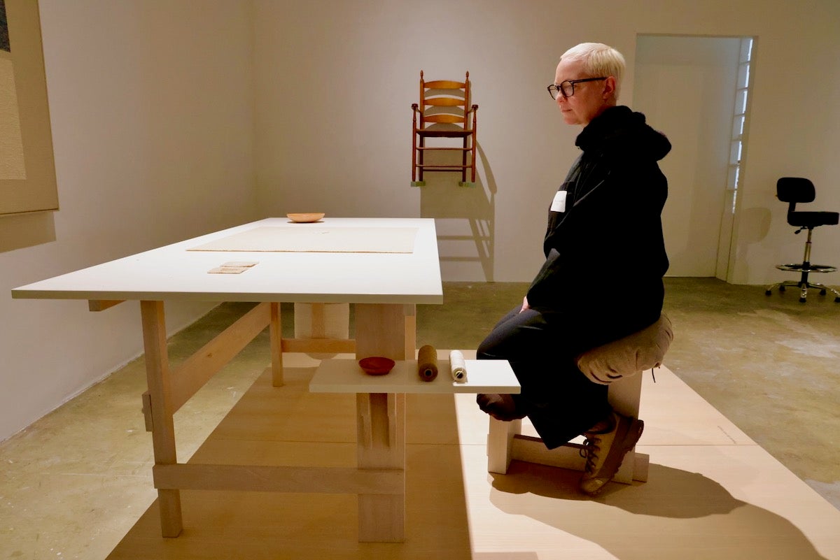 Chris Liljenberg Halstrøm poses with work created for exhibit