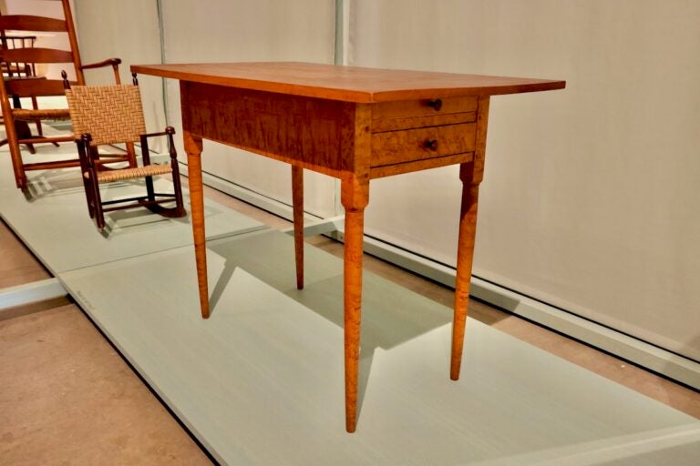An 1840 Shaker crafted side table on display
