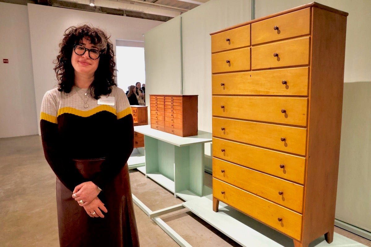 Shoshana Resnikoff posing for photo beside artwork