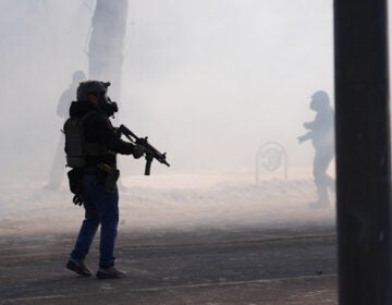 Federal immigration officers deploy tear gas after a shooting in Minneapolis