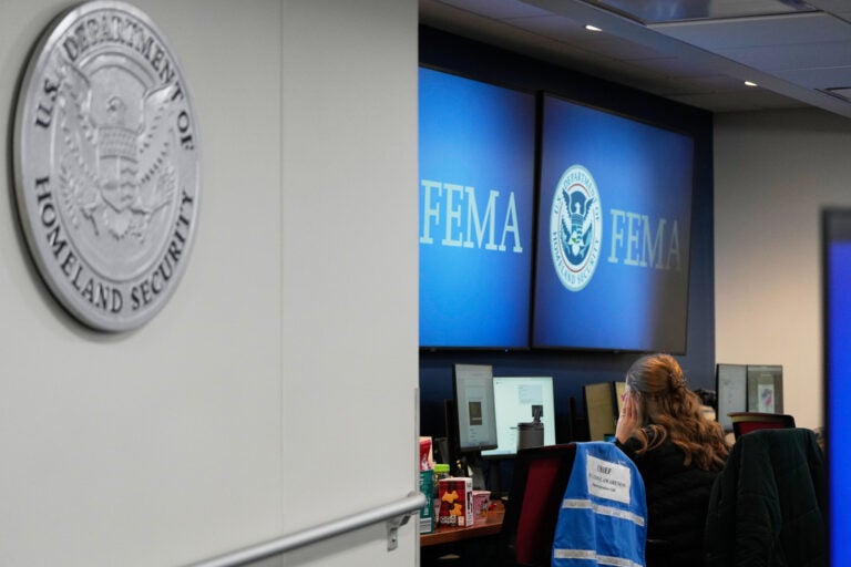 A person works at Federal Emergency Management Agency headquarters