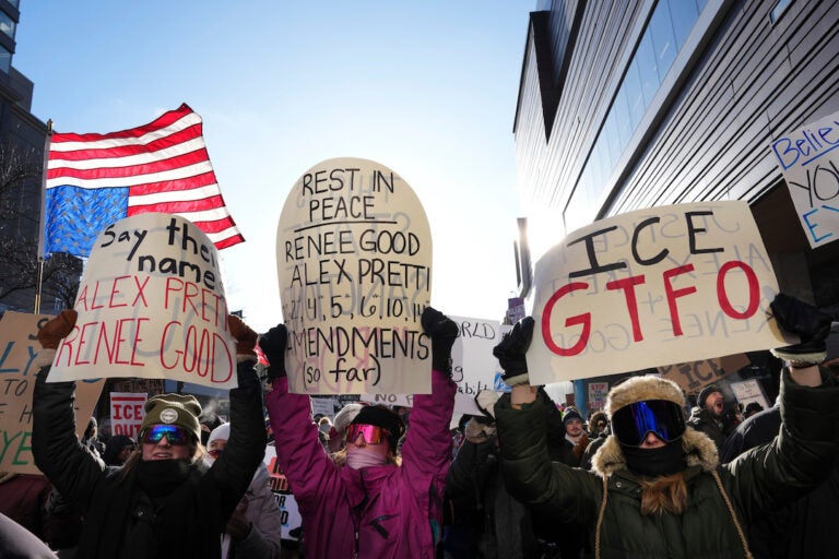 People protest against ICE (Immigration and Customs Enforcement) in downtown Minneapolis, Sunday, Jan. 25, 2026. (AP Photo/Adam Gray)