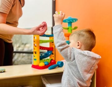 a child plays with a toy