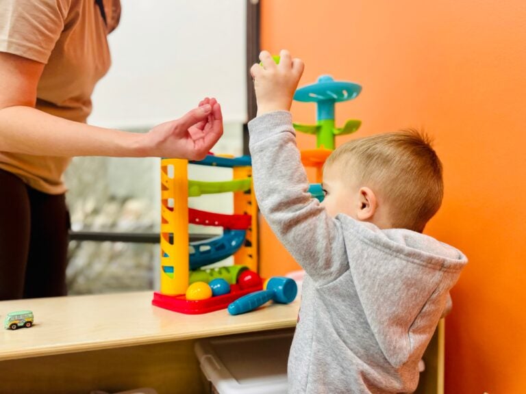 a child plays with a toy
