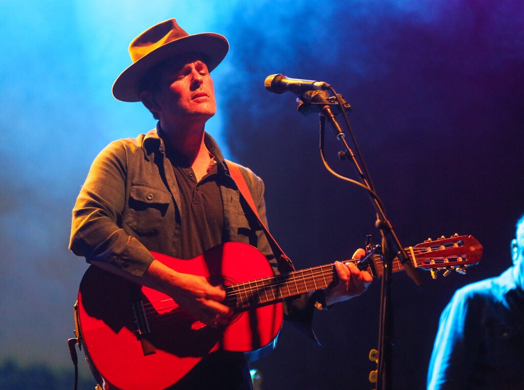 Gregory Alan Isakov performs acoustic guitar on stage