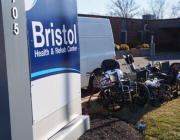 Wheelchairs and other debris are scattered amid structural damage after a massive explosion and fire caused a collapse at the nursing home in Bristol, Pennsylvania