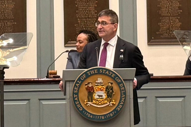 Matt Meyer standing at a podium giving a speech in Legislative Hall