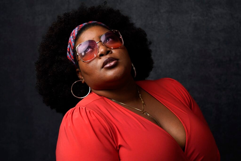 Dulce Sloan looking up as she poses during a promotional photo shoot