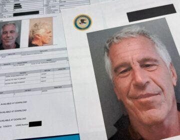 Jeffrey Epstein's face is seen among documents in DOJ files