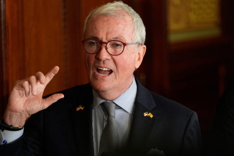 Phil Murphy expressively speaking during a press conference