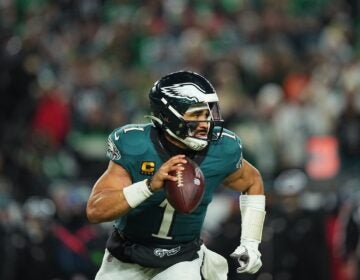Philadelphia Eagles quarterback Jalen Hurts runs the ball
