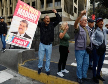 Venezuela US Supporters display a poster of Venezuelan President Nicolás Maduro in Caracas, Venezuela