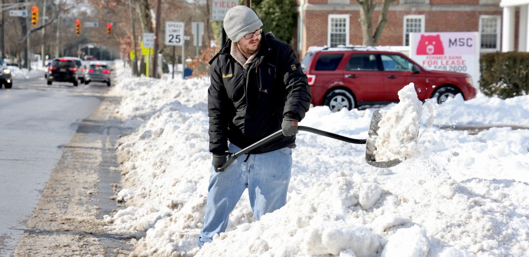 Griffin Maylath of Haddon Township digs out after a winter storm