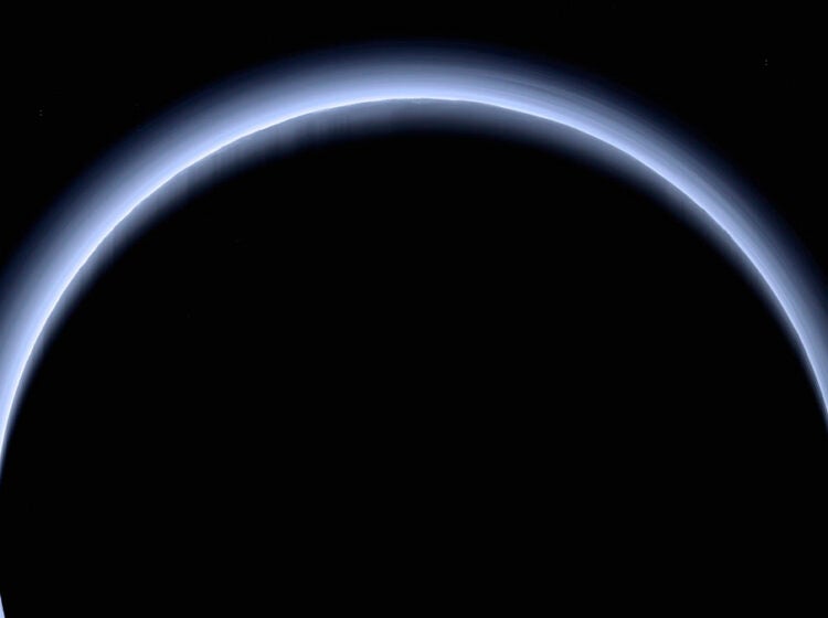 This image made available by NASA in March 2017 shows Pluto illuminated from behind by the sun as the New Horizons spacecraft travels away from it at a distance of about 120,000 miles. (NASA/Johns Hopkins University Applied Physics Laboratory/Southwest Research Institute via AP)