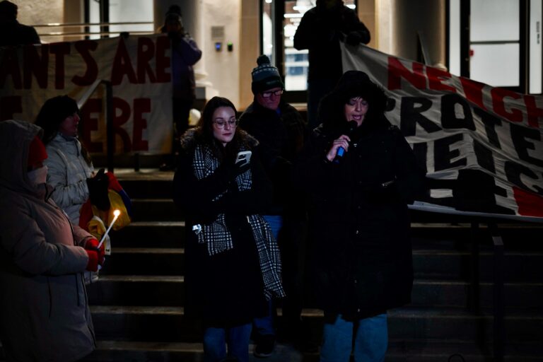 Advocates and community members hold a vigil outside of Norristown Municipal Hall condemning ICE's actions in Montgomery County.