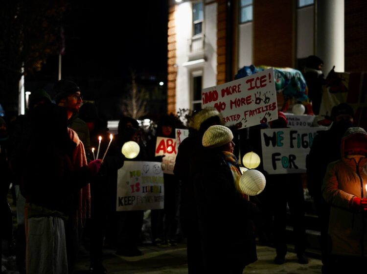 Advocates and community members hold a vigil outside of Norristown Municipal Hall condemning ICE's actions in Montgomery County.
