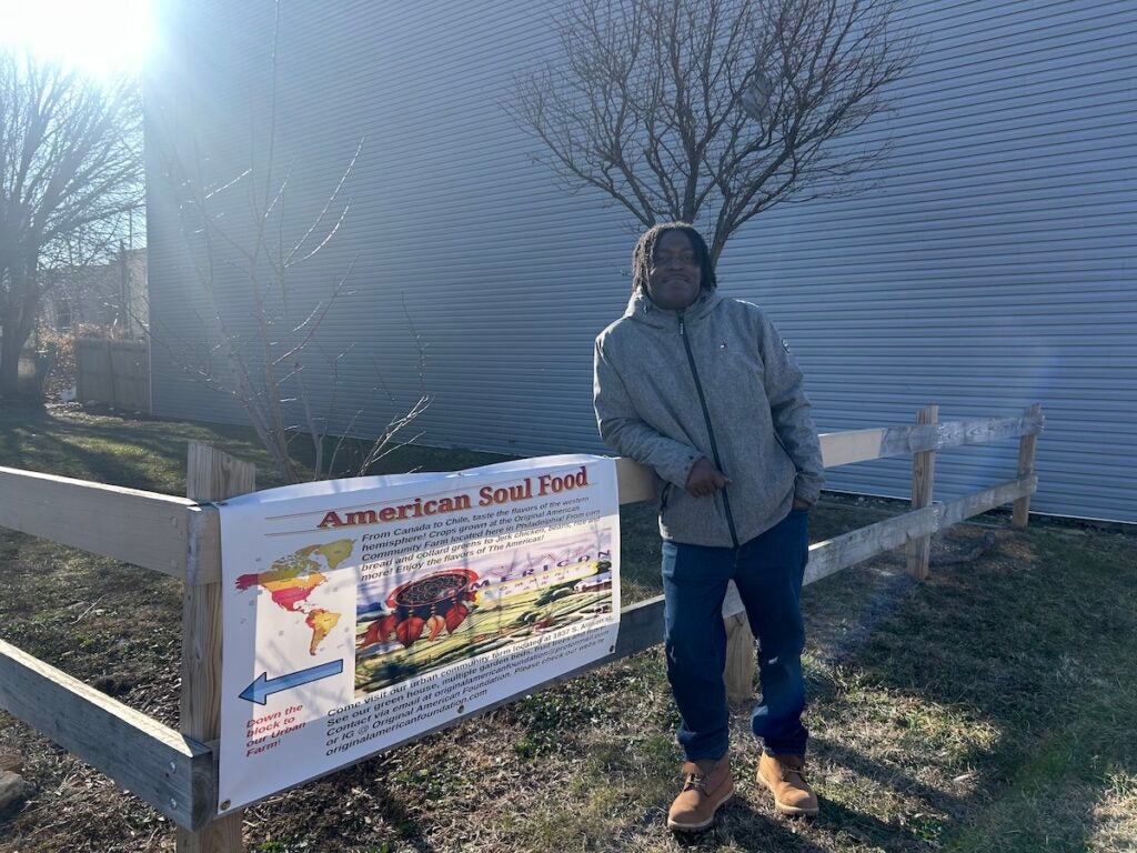 Jovian Patterson standing next to a lot used by Original American Foundation