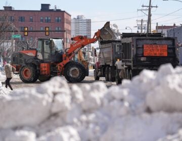 Snow is removed in the aftermath of a winter storm in Philadelphia, Monday, Jan. 26, 2026