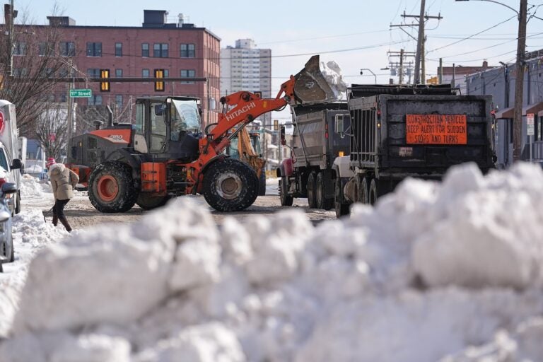 Snow is removed in the aftermath of a winter storm in Philadelphia, Monday, Jan. 26, 2026