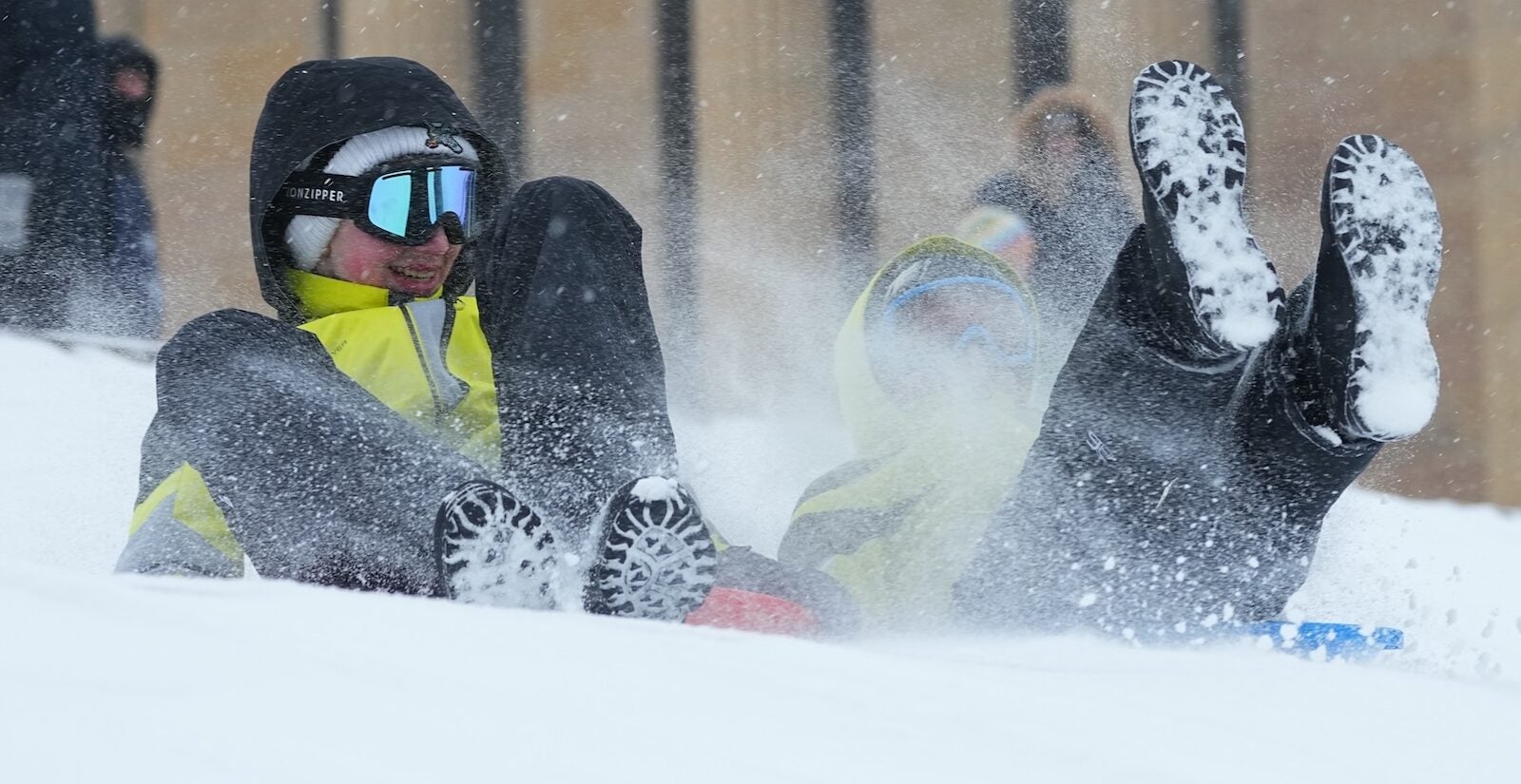 People sled on Philadelphia Art Museum steps during a winter storm in Philadelphia, Sunday, Jan. 25, 2026.