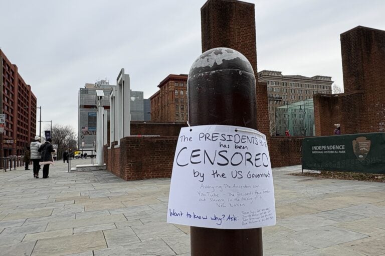 Handwritten signs reading 