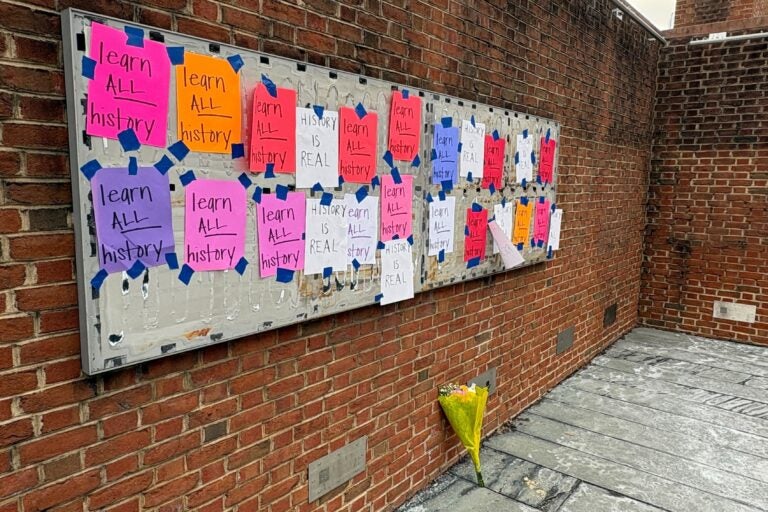 Handwritten signs reading 