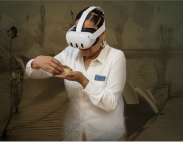 print-center-2026-01-09 A woman who is wearing a VR headset is eating a taco
