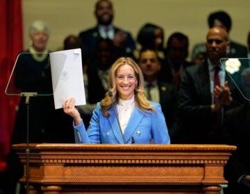 New Jersey Governor New Jersey Gov. Mikie Sherrill holds up a just signed executive order